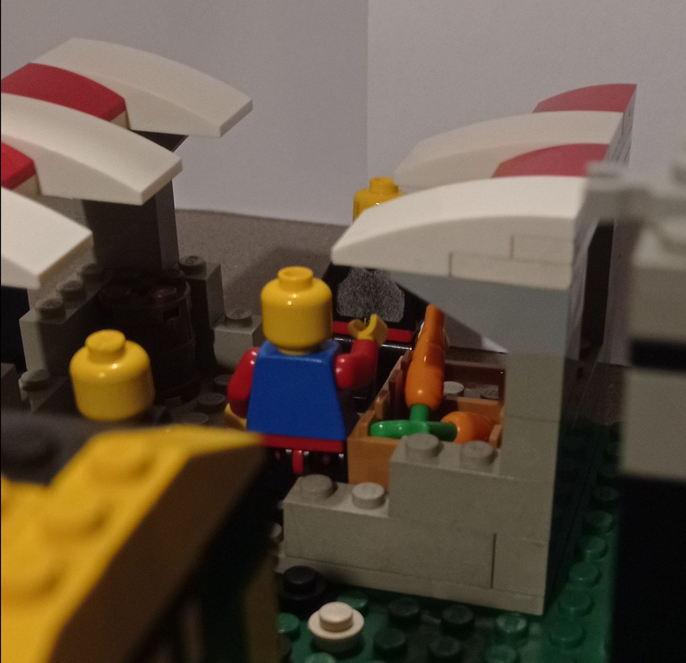 A lego model of a market with a yellow head