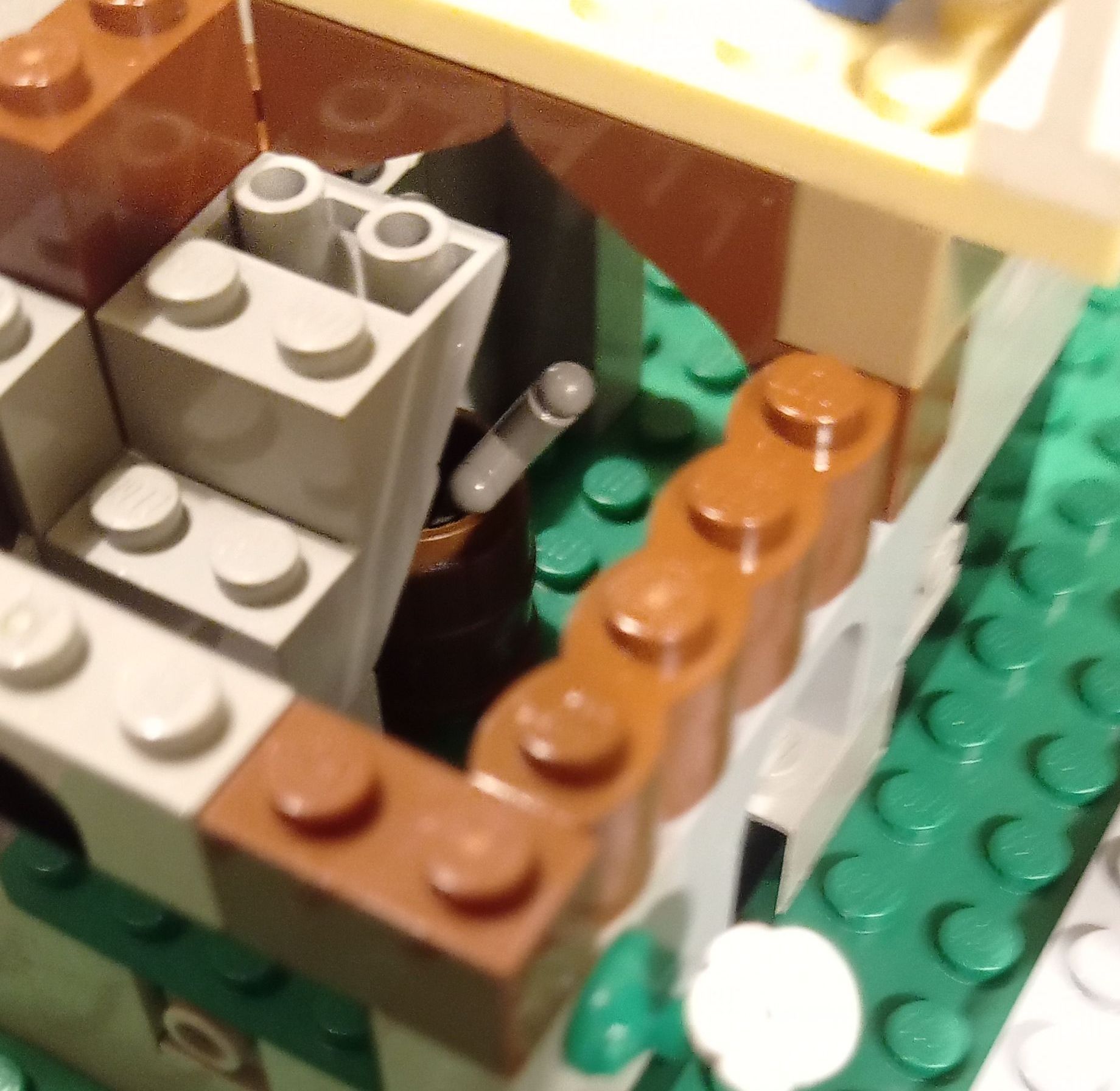 A close up of a lego set with brown and white bricks