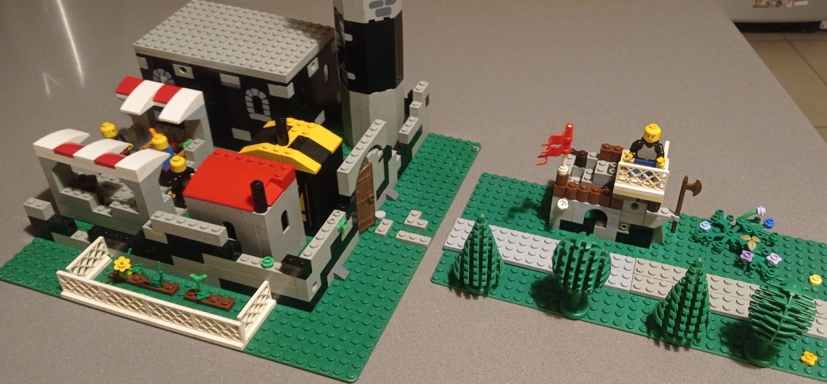 A lego model of a castle is sitting on a table