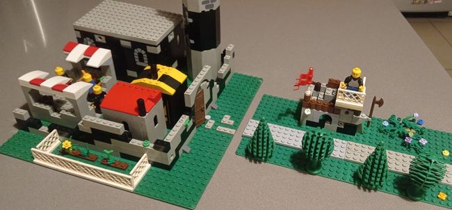 A lego model of a castle is sitting on a table