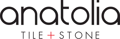 The logo for anatolia tile and stone is black and white.