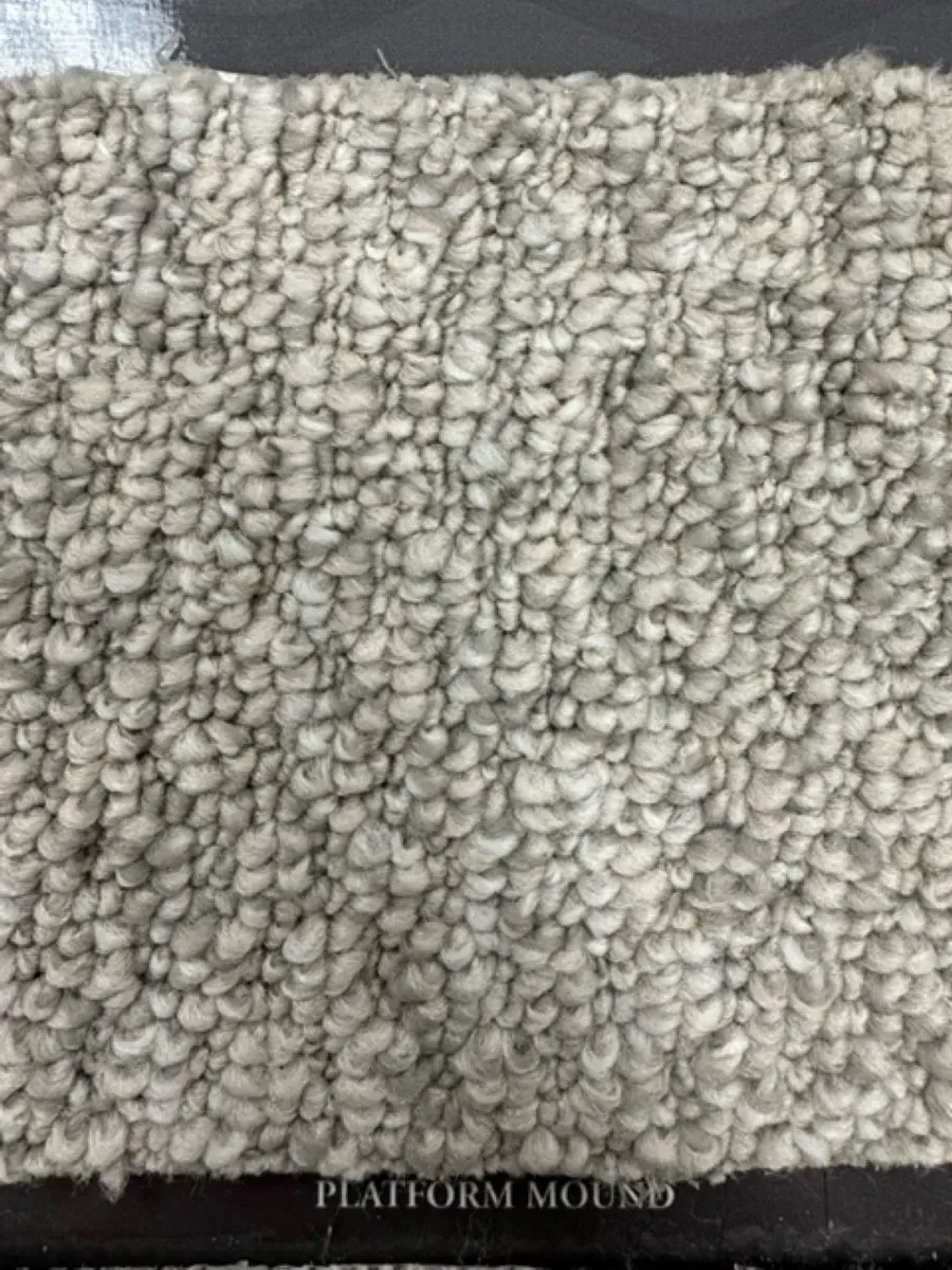 A close up of a piece of carpet on a table.