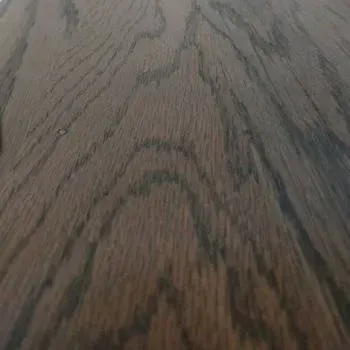A close up of a piece of wood with a grain pattern.