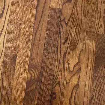 A close up of a wooden floor with a grain pattern.