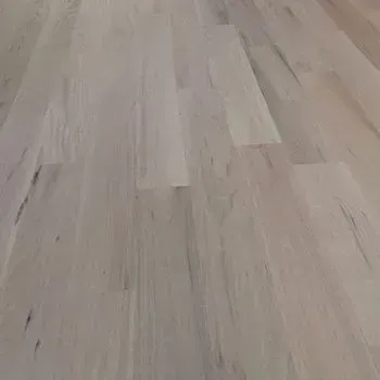 A close up of a white wooden floor.