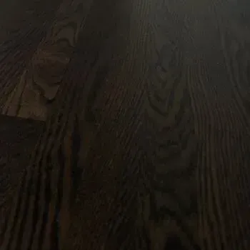 A close up of a dark wooden floor.