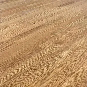 A close up of a wooden floor in a house.