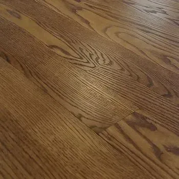 A close up of a wooden floor in a house.