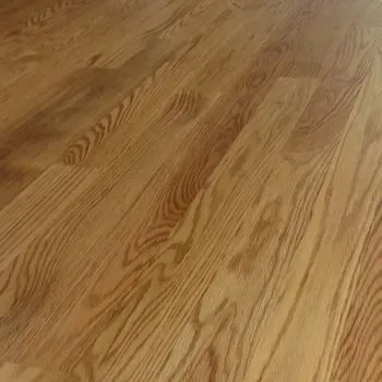 A close up of a wooden floor in a living room.