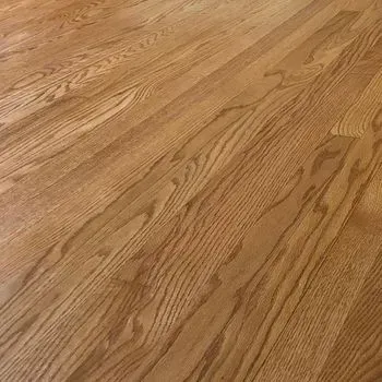 A close up of a wooden floor in a room.