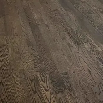 A close up of a wooden floor in a room.
