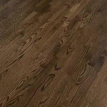 A close up of a wooden floor in a room.