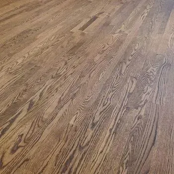 A close up of a wooden floor in a room.