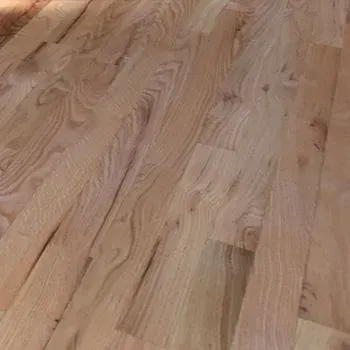 A close up of a wooden floor in a room.