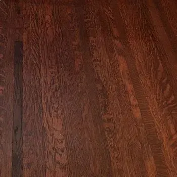A close up of a wooden floor in a room.
