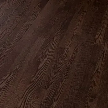 A close up of a dark wooden floor in a room.