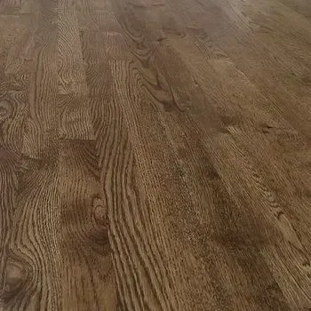 A close up of a wooden floor in a house.