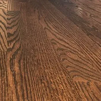 A close up of a wooden floor with a grain pattern.