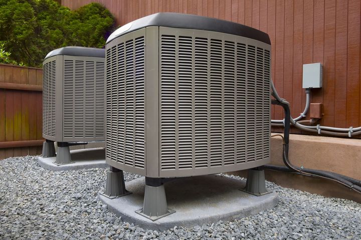 Two Air Conditioners Outside the House