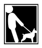 A man is walking a small dog on a leash.