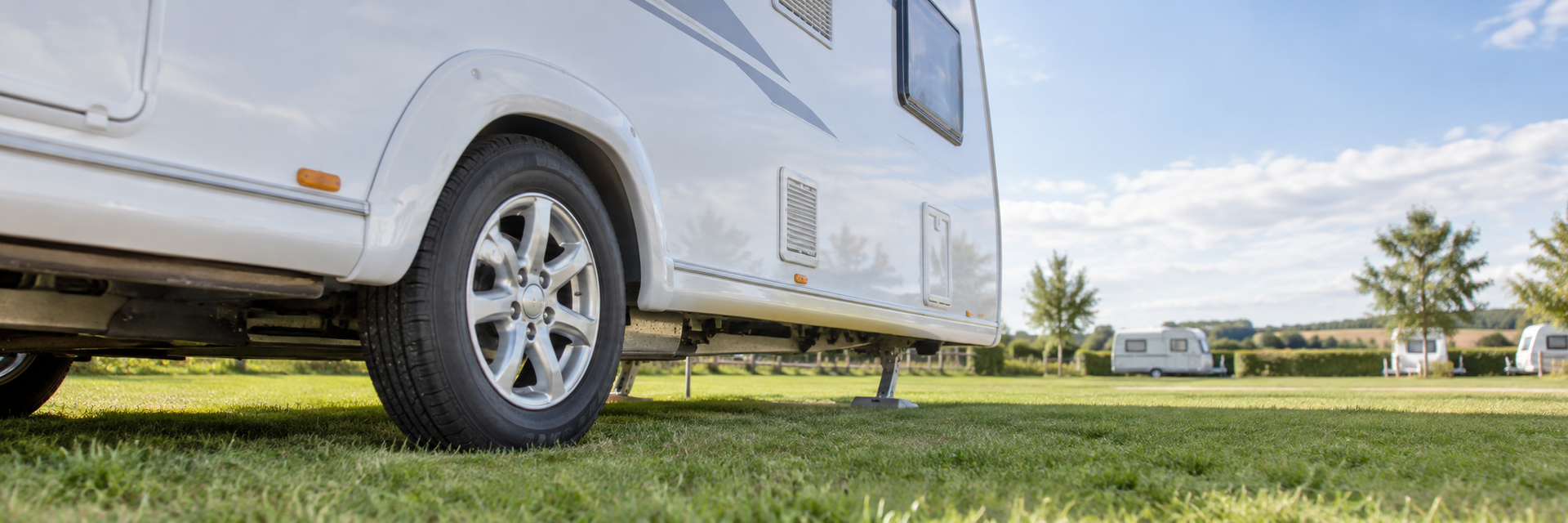 Caravan tyre being checked for age, pressure and sidewall condition.