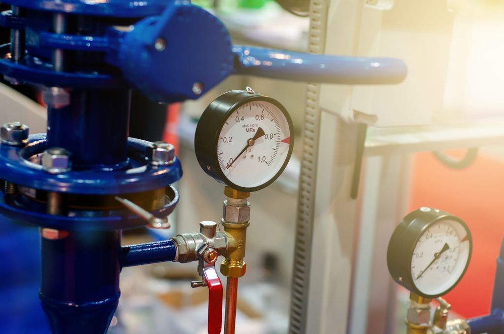 A Close Up of a Valve With Two Pressure Gauges Attached to It — J & N Plumbing Pty Ltd In Tamworth, NSW