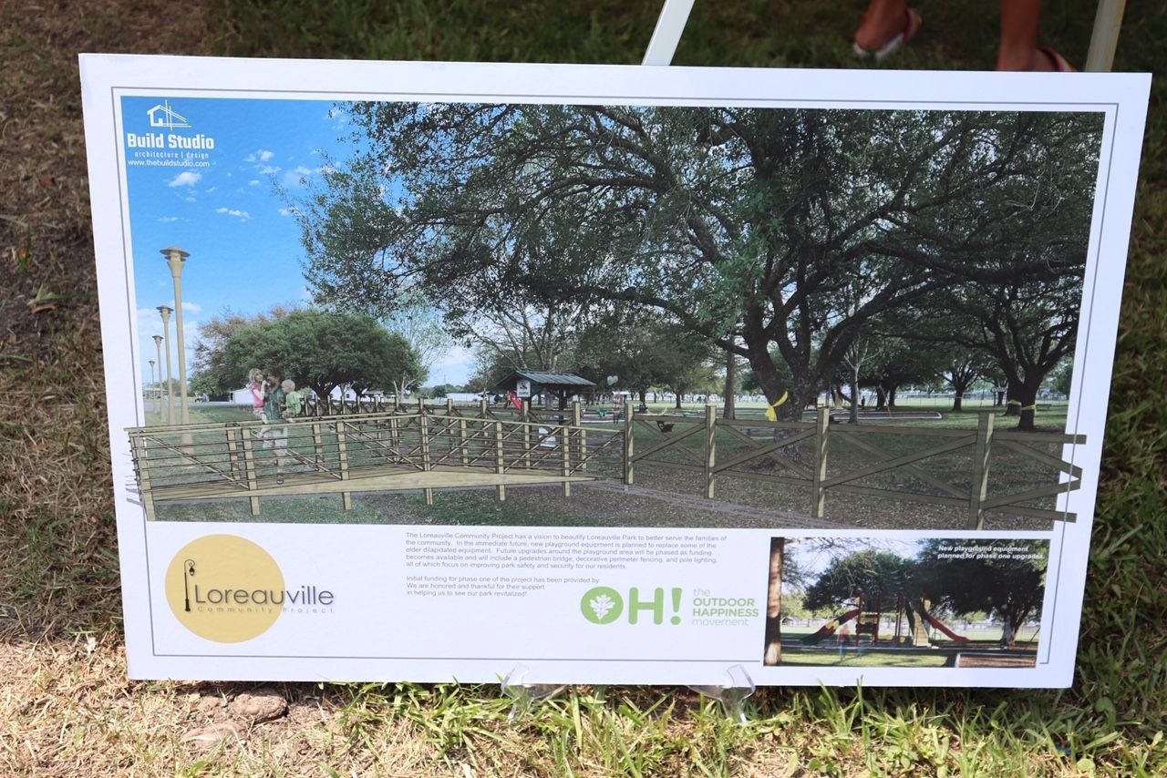 A picture of a park with trees and a sign that says oh