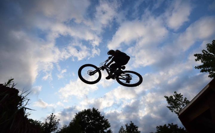 A person is doing a trick on a bike in the air