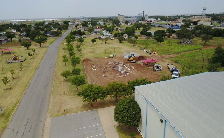 An aerial view of a construction site in a small town.