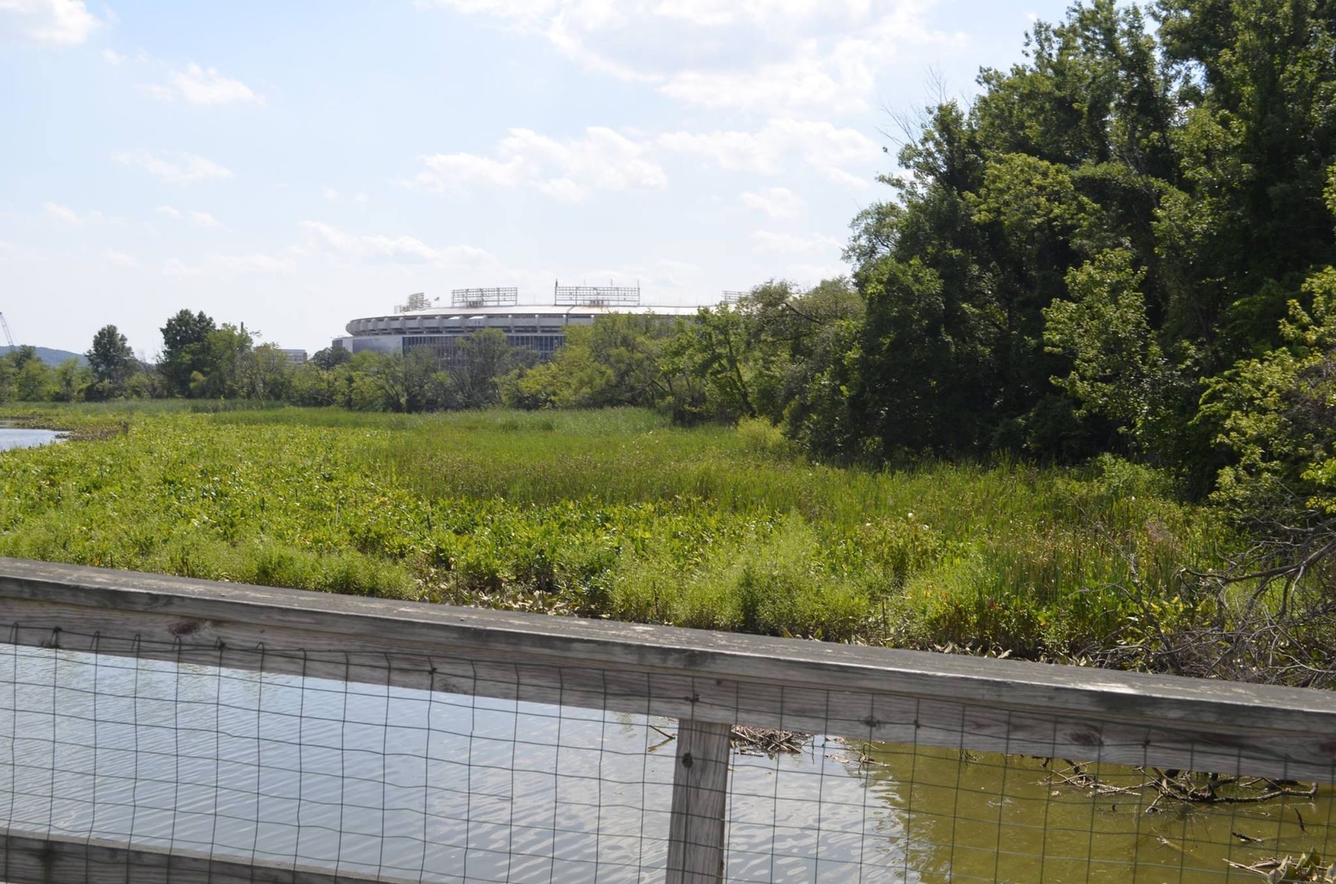 A bridge over a body of water with a building in the background