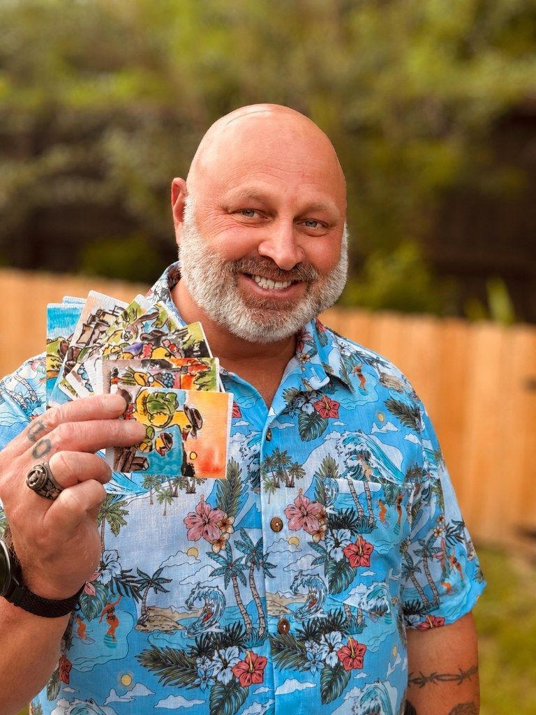 Timothy Colomer holding a handful of Duck and Compass explorer
cards