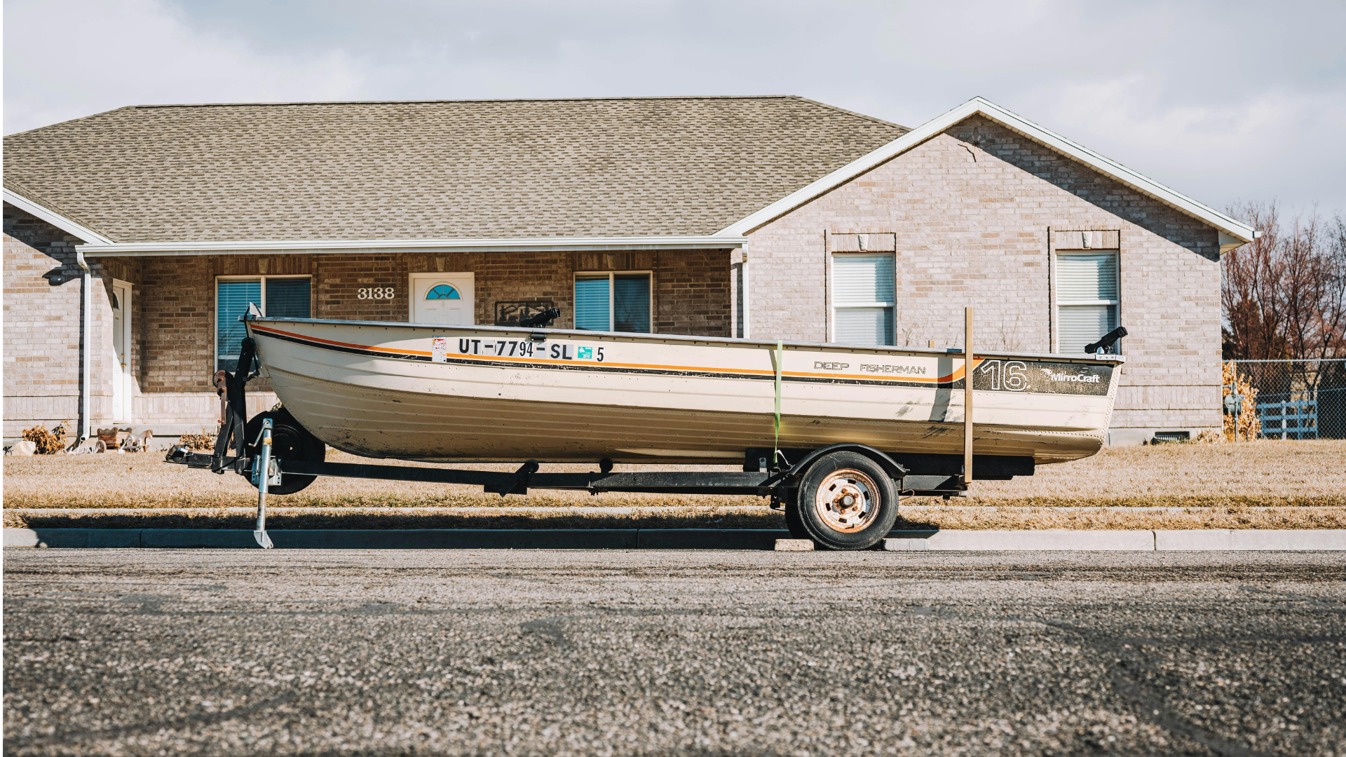 Secure boat storage facility with organized boat and trailer storage spaces for convenient vessel parking