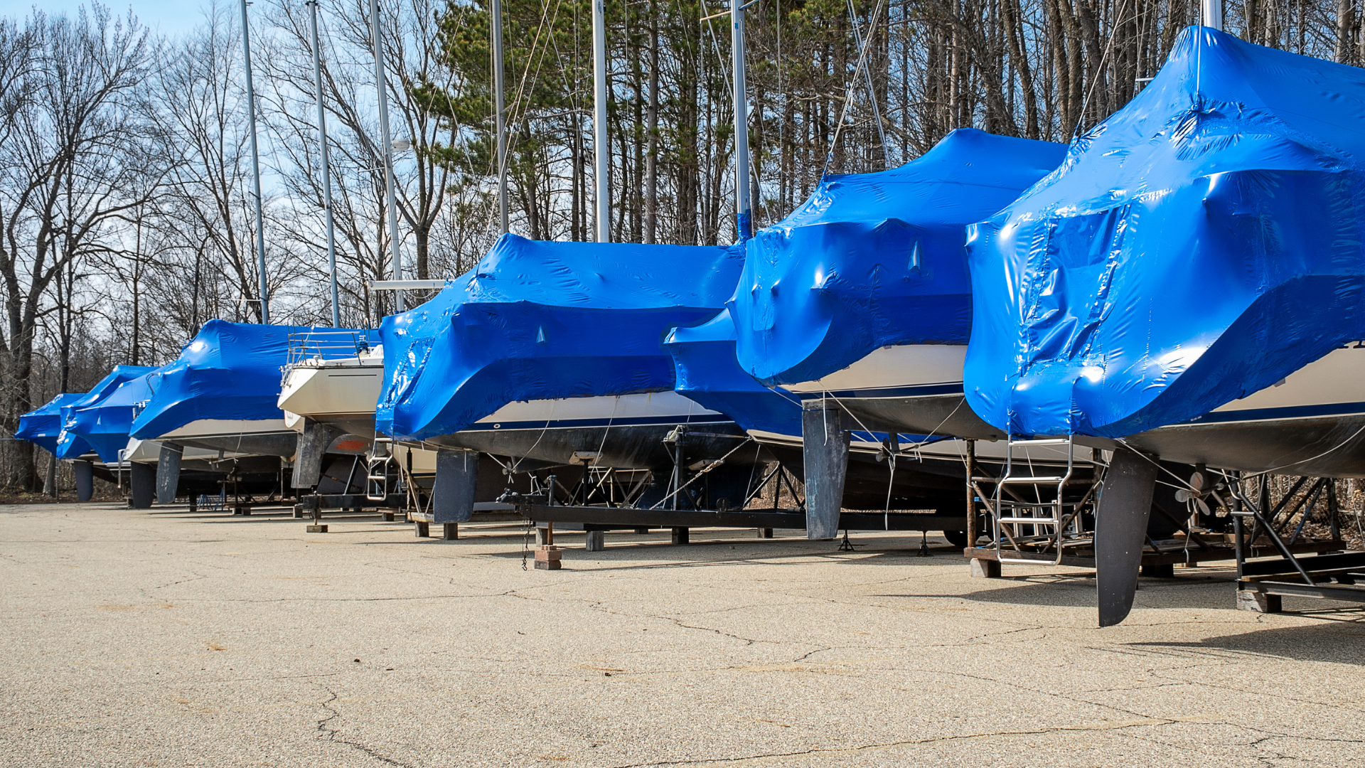 Covered boat storage spaces and outdoor boat storage parking with easy boat retrieval access