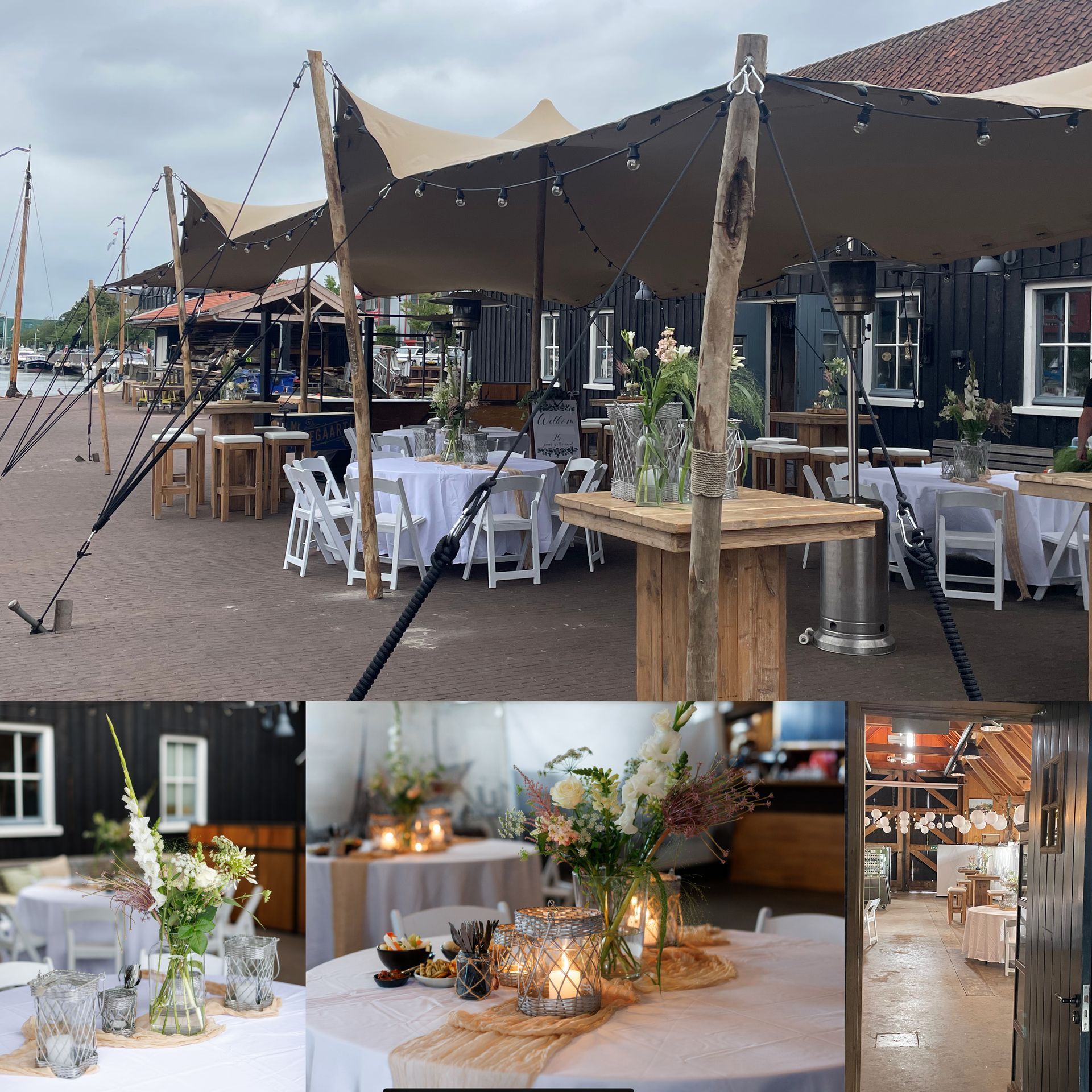 Een evenementenlocatie in de buitenlucht met overdekte zitplaatsen, tafels met bloemstukken en een houten gebouw.