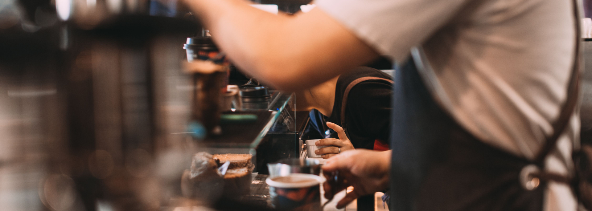 Picture of someone working in a cafe. 