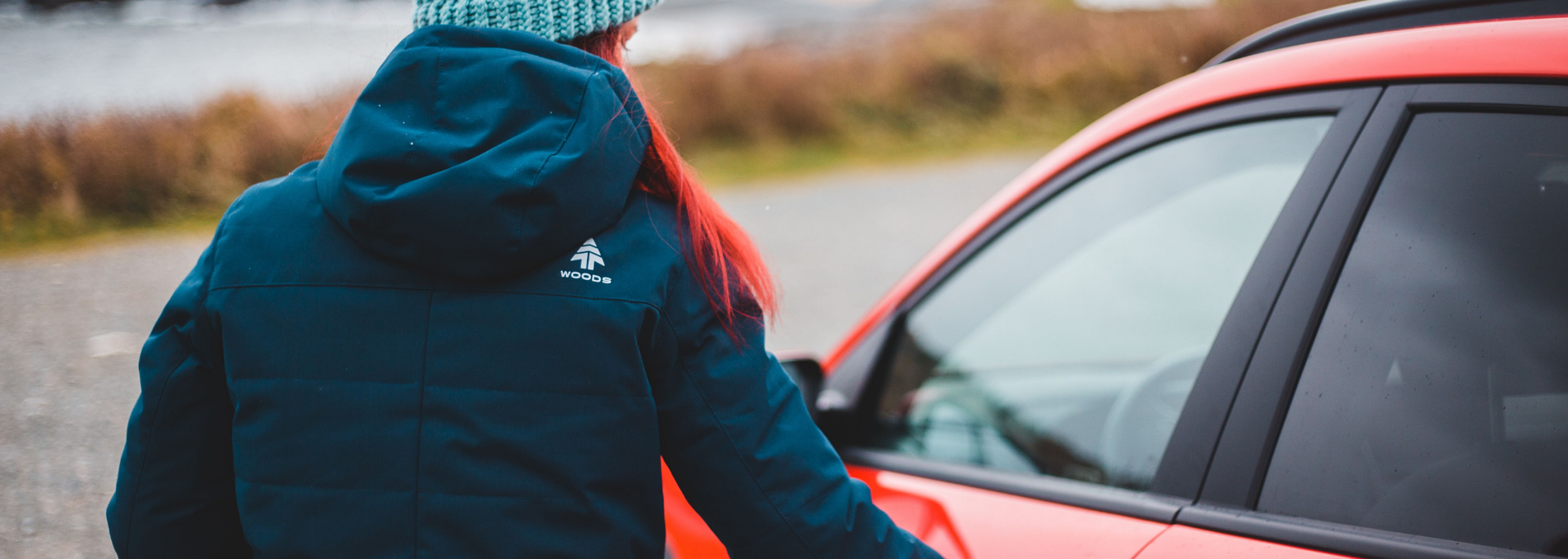 Picture of someone approaching a car. 