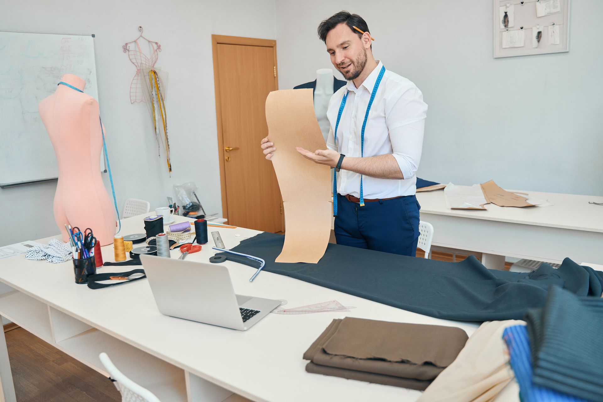 Men Wear Stylist Facing Laptop — Wentworthville, NSW — Avesta Tailoring
