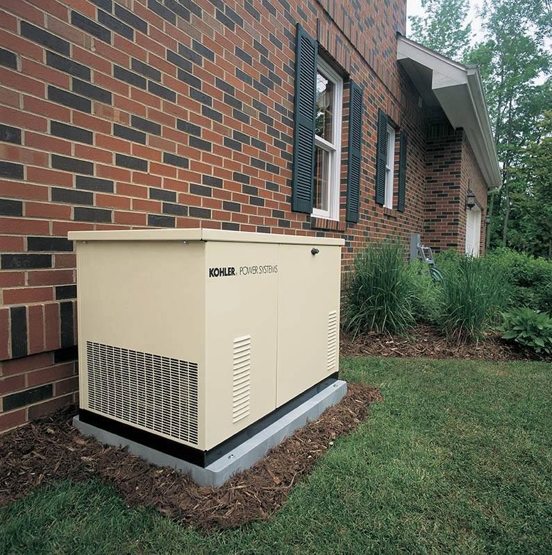 Beige outdoor HVAC unit beside a brick house, next to a lawn and shrubs.