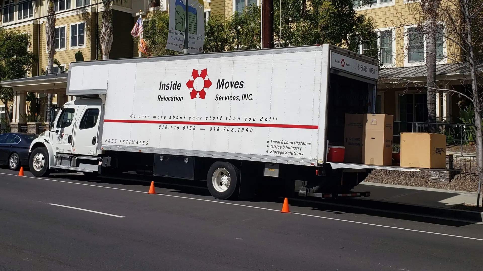 White moving truck parked on residential street