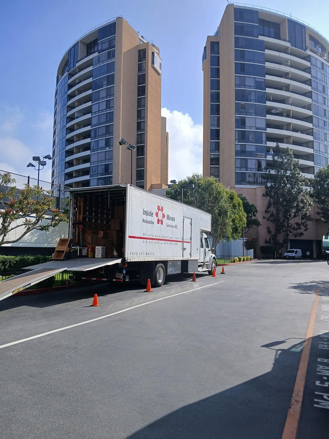 Truck parked outside two high rise building