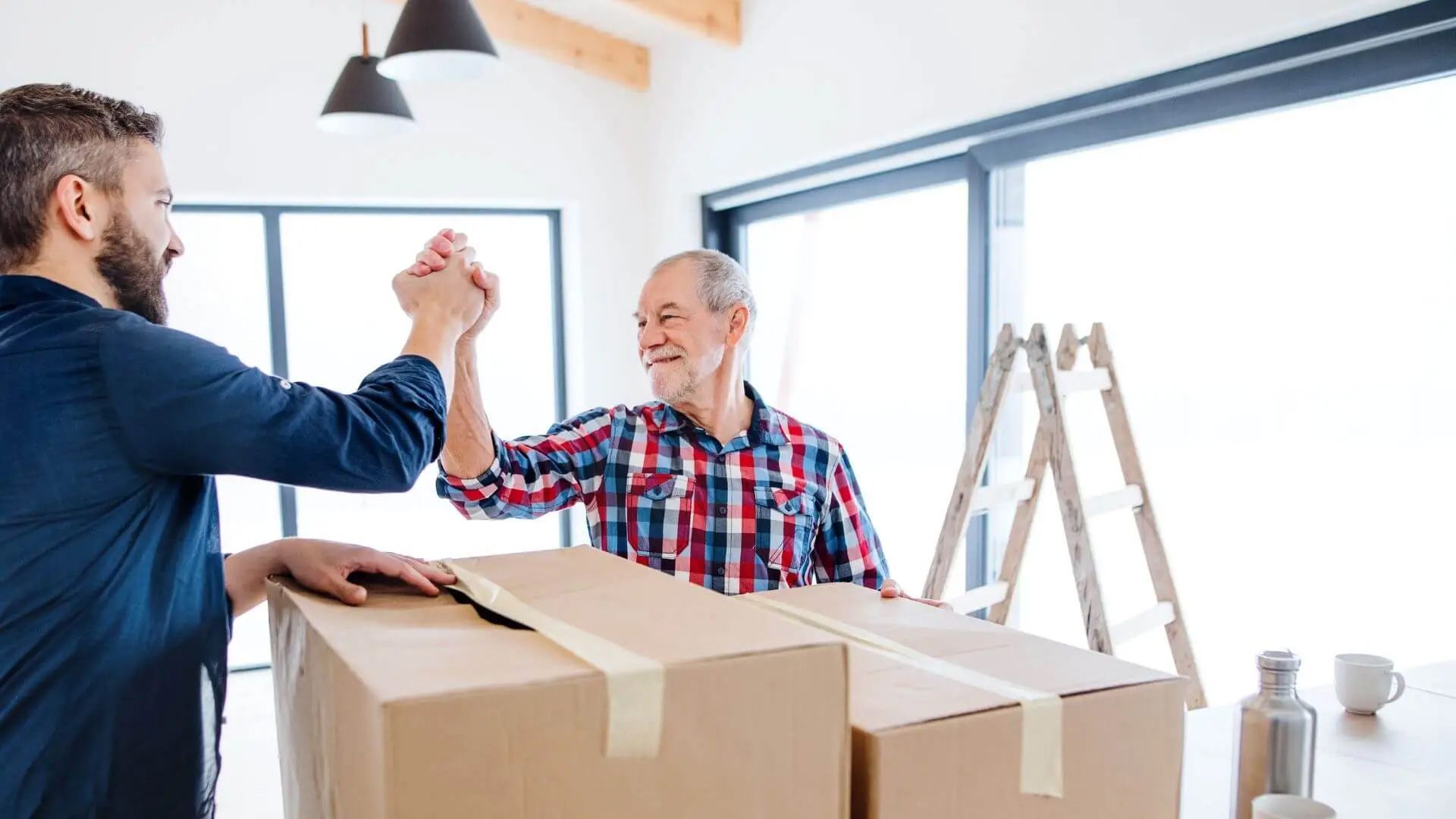 Worker and senior man having a high-five