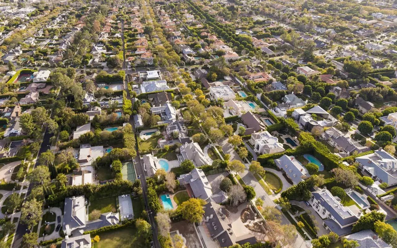 Aerial view of a residential houses with trees
