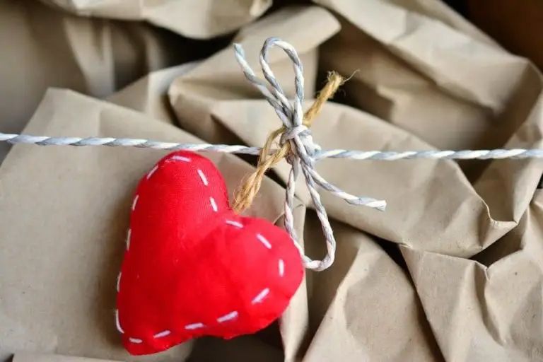 Red heart ornament tied with twine