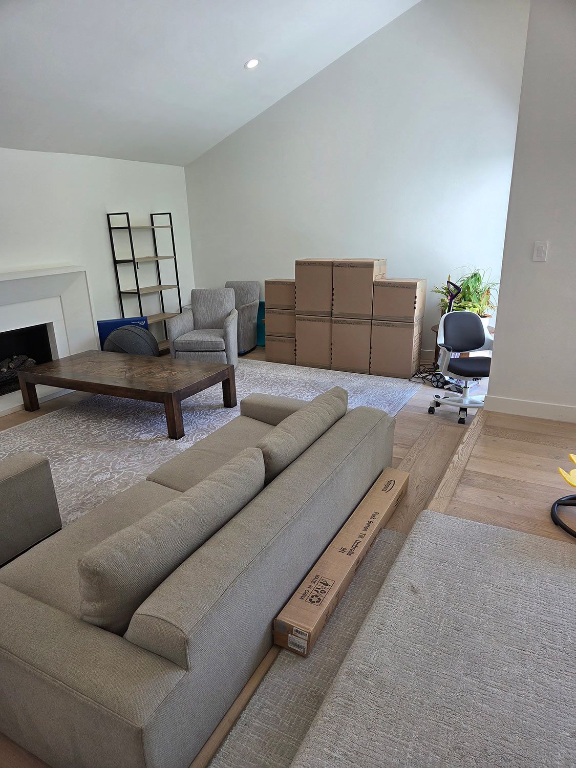 Living room with stacked moving boxes