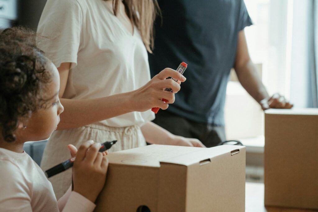 People packing boxes together