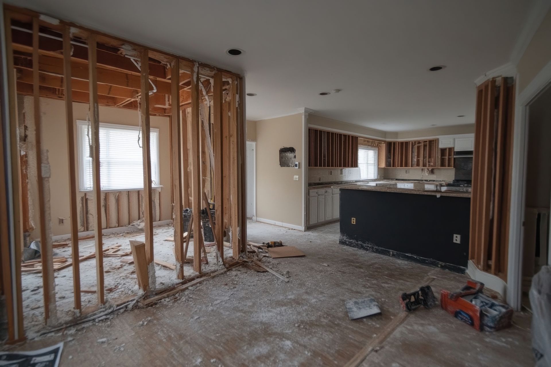 Home interior during wall demolition Sevierville with exposed framing and debris.