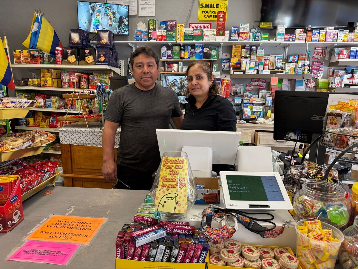 Raúl and Lucía, owners of Mini Market Mundo Latino, behind the counter in Avon, Colorado