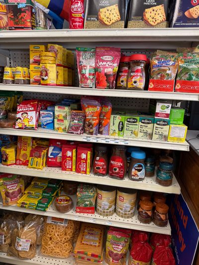 Latin groceries and pantry staples on the shelves at Mini Market Mundo Latino, photo 7