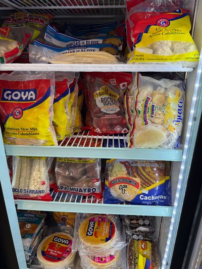 Latin groceries and pantry staples on the shelves at Mini Market Mundo Latino, photo 3