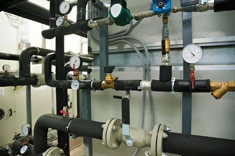Black Pipes With Insulation, Brass and Blue Fittings — David Lewis Solahart in Alstonville, NSW